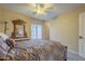 Well-lit bedroom showcasing a floral comforter and a large window at 27316 N Covered Wagon Rd, Phoenix, AZ 85085