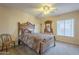 Cozy bedroom featuring a comfortable bed, ceiling fan, and a window at 27316 N Covered Wagon Rd, Phoenix, AZ 85085