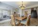 A traditionally styled dining room featuring a decorative light fixture and hardwood table with ornate chairs at 27316 N Covered Wagon Rd, Phoenix, AZ 85085