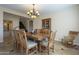 The dining area features wooden furnishings and seamless integration to a cozy living space at 27316 N Covered Wagon Rd, Phoenix, AZ 85085