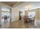 This dining room features tile flooring and a decorative light fixture at 27316 N Covered Wagon Rd, Phoenix, AZ 85085