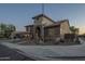 Beautiful two-story home featuring a three car garage and desert landscaping at 27316 N Covered Wagon Rd, Phoenix, AZ 85085