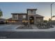 Beautiful two-story home featuring desert landscaping, a three-car garage, and a stone-accented entrance at 27316 N Covered Wagon Rd, Phoenix, AZ 85085