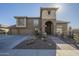 Inviting two-story home with stone accents, desert landscaping, and a spacious three-car garage at 27316 N Covered Wagon Rd, Phoenix, AZ 85085