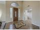 The grand entryway showcases a beautiful wooden door and elegant tile flooring with a decorative inlay at 27316 N Covered Wagon Rd, Phoenix, AZ 85085