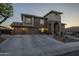 Beautiful two-story home with a three-car garage and a desert-style landscaped yard at 27316 N Covered Wagon Rd, Phoenix, AZ 85085