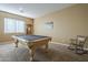 A cozy game room featuring a pool table, comfortable seating, and a relaxing atmosphere at 27316 N Covered Wagon Rd, Phoenix, AZ 85085