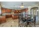 Spacious kitchen featuring wooden cabinetry, stainless steel appliances, and a large island at 27316 N Covered Wagon Rd, Phoenix, AZ 85085