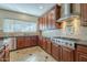 Well-appointed kitchen featuring a center island, updated appliances, and custom cabinetry at 27316 N Covered Wagon Rd, Phoenix, AZ 85085