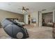 Large primary bedroom with fireplace, seating, and an ensuite bathroom at 27316 N Covered Wagon Rd, Phoenix, AZ 85085