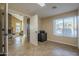 Open floor plan view into an office, and living area, featuring tile floors at 27316 N Covered Wagon Rd, Phoenix, AZ 85085