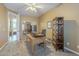A home office features carpeted floors, natural light, and a mirrored closet at 27316 N Covered Wagon Rd, Phoenix, AZ 85085