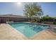 Sparkling pool surrounded by a tiled patio with lounge chairs at 27316 N Covered Wagon Rd, Phoenix, AZ 85085