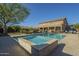 Beautiful backyard with a sparkling swimming pool and mature landscaping at 27316 N Covered Wagon Rd, Phoenix, AZ 85085