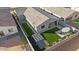An aerial view of a home showcasing the backyard patio and lush green lawn at 3187 E Pineapple Rd, San Tan Valley, AZ 85143