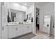 A stunning bathroom with walk-in closet and large, mirrored vanity at 3187 E Pineapple Rd, San Tan Valley, AZ 85143