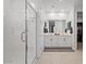 This bathroom boasts a large glass-enclosed shower and dual vanity at 3187 E Pineapple Rd, San Tan Valley, AZ 85143