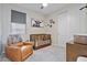 A cute Bedroom with crib, chair, closet and changing table at 3187 E Pineapple Rd, San Tan Valley, AZ 85143