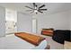 A relaxing bedroom with unique ceiling fan and view to bathroom at 3187 E Pineapple Rd, San Tan Valley, AZ 85143