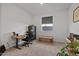 Functional bedroom featuring a desk, a rolling office chair, and storage options at 3187 E Pineapple Rd, San Tan Valley, AZ 85143