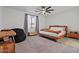 A spacious bedroom featuring a unique ceiling fan and wood decor at 3187 E Pineapple Rd, San Tan Valley, AZ 85143