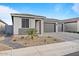 Charming home featuring a two-car garage and attractive desert landscaping at 3187 E Pineapple Rd, San Tan Valley, AZ 85143