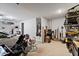 Spacious garage with ample storage space, a car, and water heater at 3187 E Pineapple Rd, San Tan Valley, AZ 85143