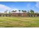 Granada Park signage featuring lush greenery, palm trees, and elegant fence lines at 3187 E Pineapple Rd, San Tan Valley, AZ 85143