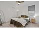 Comfortable main bedroom with a plush bed, a stylish bedside table, and closet with sliding doors at 3187 E Pineapple Rd, San Tan Valley, AZ 85143