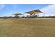 Picture of covered playground featuring walking paths and picnic area for relaxation and outdoor activities at 3187 E Pineapple Rd, San Tan Valley, AZ 85143
