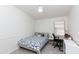 This bedroom includes a ceiling fan, light wood flooring, and a workspace at 3206 W Knudsen Dr, Phoenix, AZ 85027
