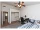 This bedroom includes a ceiling fan, carpet flooring, and a built-in closet at 3206 W Knudsen Dr, Phoenix, AZ 85027