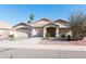 Charming single-story home featuring a three-car garage, desert landscaping, and a welcoming entrance at 3206 W Knudsen Dr, Phoenix, AZ 85027