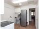 Spacious laundry room with modern appliances, tile floors, and plenty of storage at 3206 W Knudsen Dr, Phoenix, AZ 85027