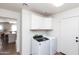 Bright laundry room featuring a newer washer and dryer and white cabinets at 3206 W Knudsen Dr, Phoenix, AZ 85027