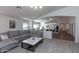 Open-concept living space with views to the kitchen, complete with a sofa and laminate flooring at 3206 W Knudsen Dr, Phoenix, AZ 85027