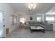 Open living room with a gray sectional, a decorative ceiling fan, and lots of natural light at 3206 W Knudsen Dr, Phoenix, AZ 85027