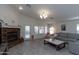 Bright living room with stone fireplace, tile flooring, and access to an outdoor space at 3206 W Knudsen Dr, Phoenix, AZ 85027