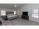 Spacious main bedroom with vaulted ceiling, ceiling fan, and light wood floors at 3206 W Knudsen Dr, Phoenix, AZ 85027