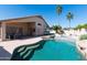 Inviting backyard pool with lush landscaping, patio area, basketball hoop, and ample space for entertaining at 3206 W Knudsen Dr, Phoenix, AZ 85027