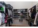 Walk-in closet with organized shelves and racks for hanging clothes and storing folded items at 3206 W Knudsen Dr, Phoenix, AZ 85027