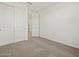 Bright bedroom with neutral carpet, closet and natural light at 3598 E Audrey Dr, San Tan Valley, AZ 85143