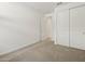 A bright bedroom featuring plush carpeting and a convenient sliding-door closet at 3598 E Audrey Dr, San Tan Valley, AZ 85143