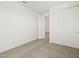 Bedroom with neutral carpet, closet and entry door at 3598 E Audrey Dr, San Tan Valley, AZ 85143