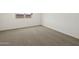 Comfortable bedroom with a window, plush carpeting, and neutral paint tones at 3598 E Audrey Dr, San Tan Valley, AZ 85143