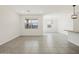 Inviting living area with large windows, modern lighting, and sleek tile flooring at 3598 E Audrey Dr, San Tan Valley, AZ 85143