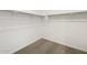 Spacious walk-in closet featuring neutral carpeting and ample hanging space at 3598 E Audrey Dr, San Tan Valley, AZ 85143