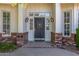 Elegant front door with sidelights, decorative hardware, and brick accents, creating a welcoming entrance at 4030 N 54Th Pl, Phoenix, AZ 85018