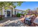 Inviting front entrance with a covered porch, brick accents, and comfortable seating area at 4030 N 54Th Pl, Phoenix, AZ 85018