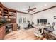 Office space features hardwood floors, custom built-ins, a ceiling fan and multiple work spaces bathed in natural light at 4030 N 54Th Pl, Phoenix, AZ 85018